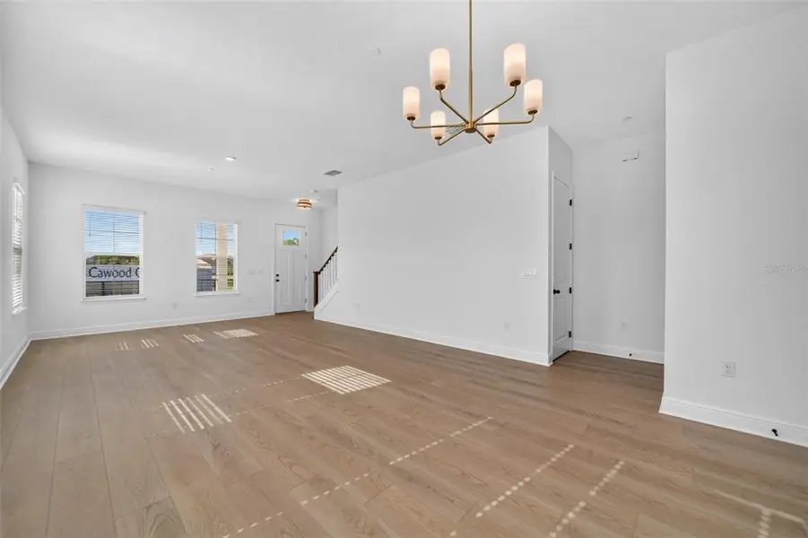 Spacious, unfurnished interior of a new home in Lake Cawood Cove, Windermere (Image 13).
