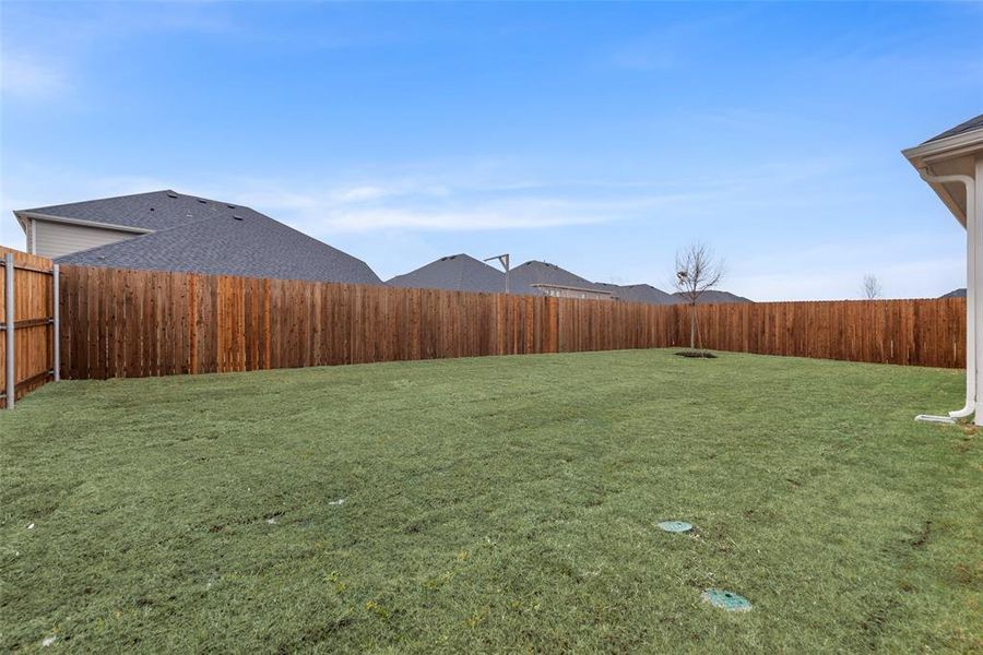 Exterior details and patio area of a home in Sutton Fields, Celina (Image 25).