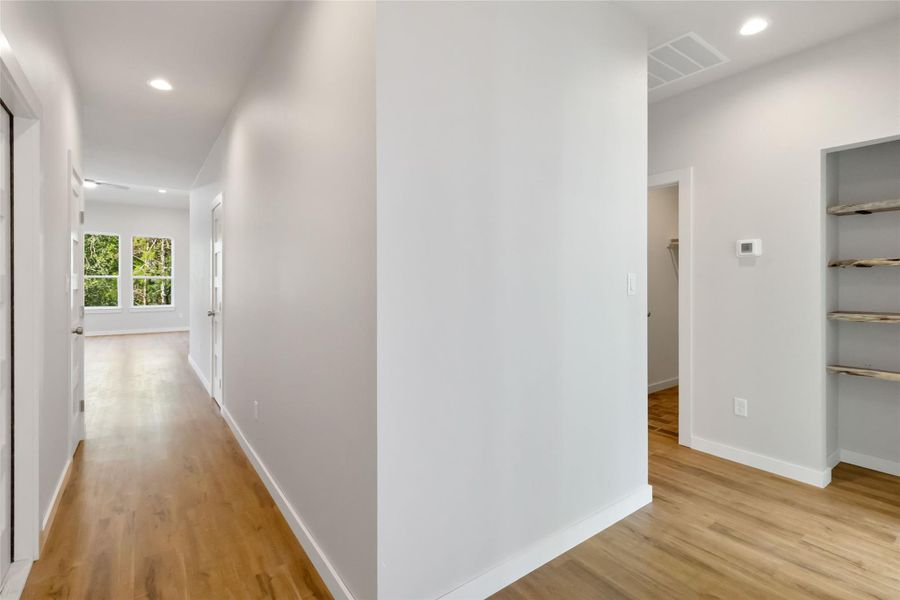 Hall featuring recessed lighting and light wood-style flooring