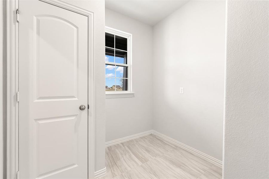 Empty room featuring baseboards