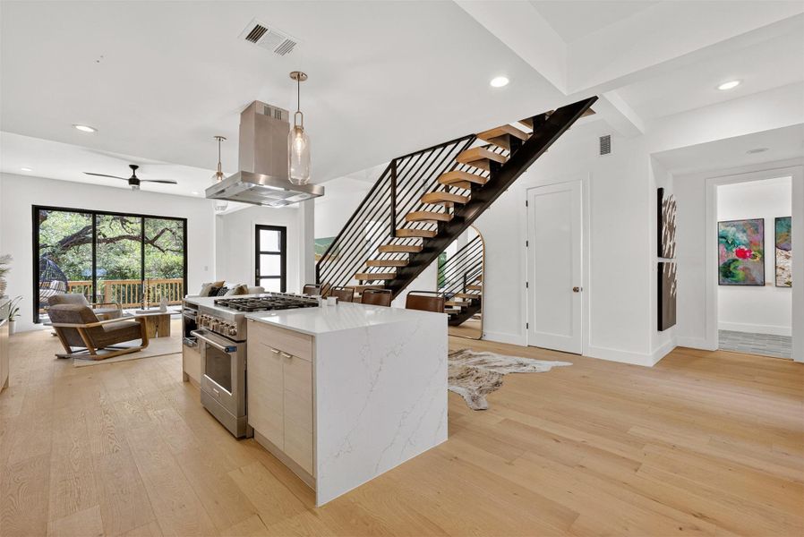 With a layout that flows seamlessly to the living and dining areas, the kitchen becomes your stage for everything from gourmet dinners to late-night snacks, all wrapped in bold, modern design With a layout that flows seamlessly to the living and dining areas, the kitchen becomes your stage for everything from gourmet dinners to late-night snacks, all wrapped in bold, modern design