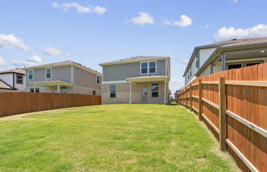 Front exterior of a new home in Saddleback at Santa Rita Ranch, Liberty Hill, TX, highlighting curb appeal (Image 16). Front exterior of a new home in Saddleback at Santa Rita Ranch, Liberty Hill, TX, highlighting curb appeal (Image 16).