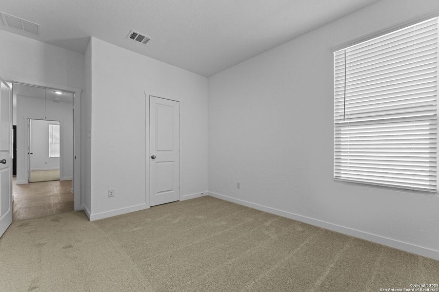 Spacious, unfurnished interior of a new home in Waterwheel: Coastline Collection, San Antonio (Image 16).