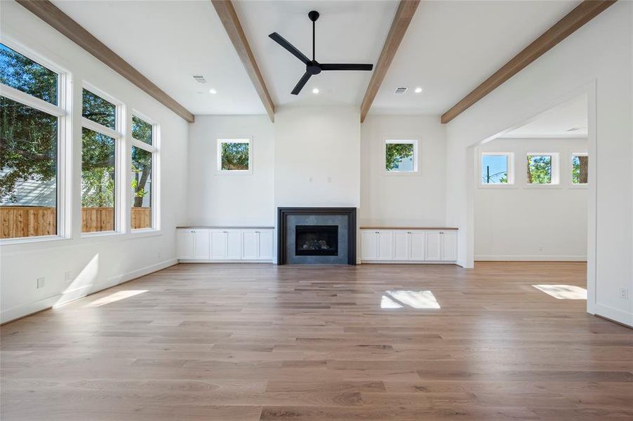 Huge great room with 13' ceiling and white oak wood beam ceiling detail