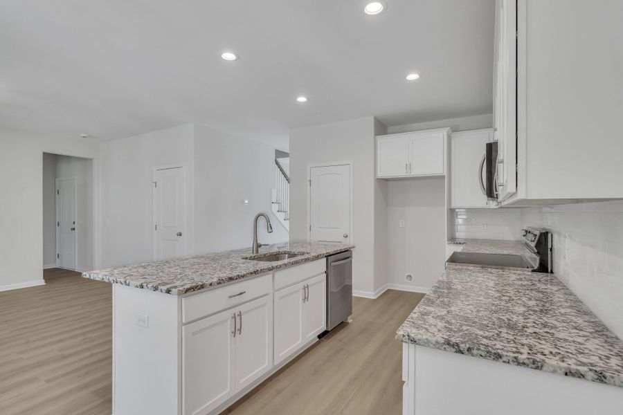 Representative furnished interior of a home built from the The Hatteras by Smith Family Homes in Ramsey Landing, Rincon (Image 7).
