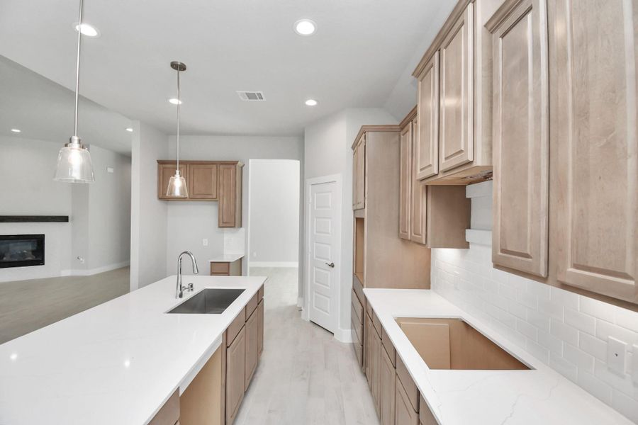 This generously spacious kitchen is a dream realized! Sample photo of completed home with similar floor plan. Actual colors and selections may vary.
