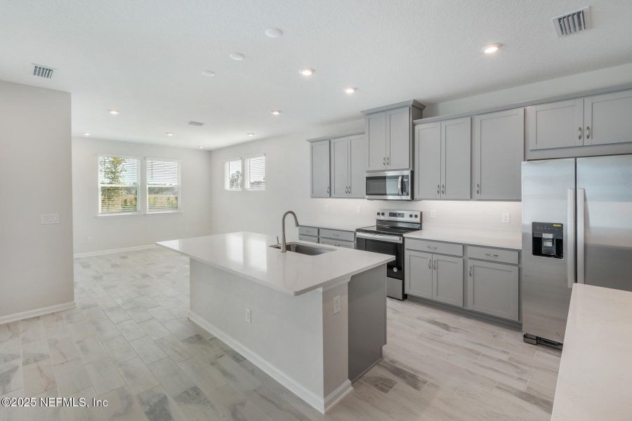 Furnished interior view inside a new home in Lakes at Bella Lago, Green Cove Springs (Image 5).