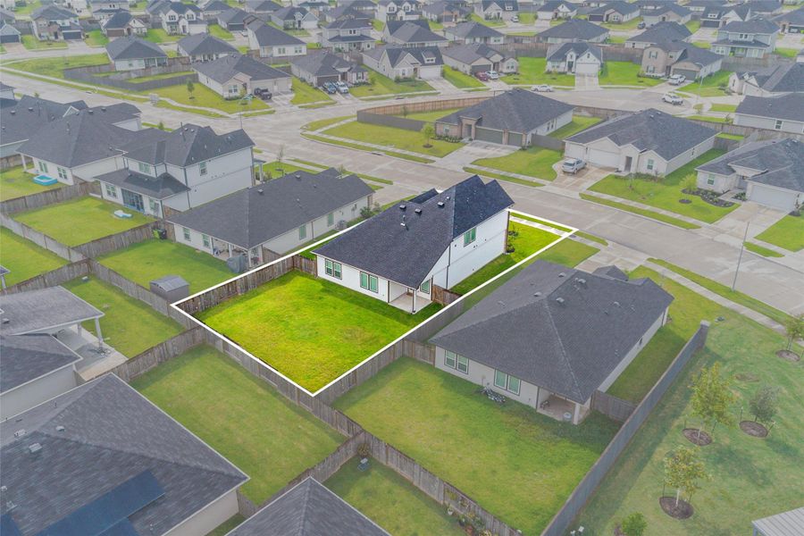 Enjoy a breathtaking aerial view of the back of the home, highlighting its spacious yard and inviting outdoor space. Enjoy a breathtaking aerial view of the back of the home, highlighting its spacious yard and inviting outdoor space.