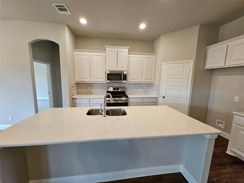 Huge kitchen island is great for entertaining.