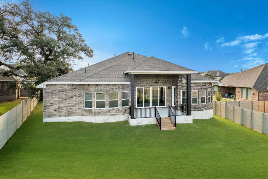 Exterior details and patio area of a home in The Grove at Vintage Oaks, New Braunfels (Image 4).