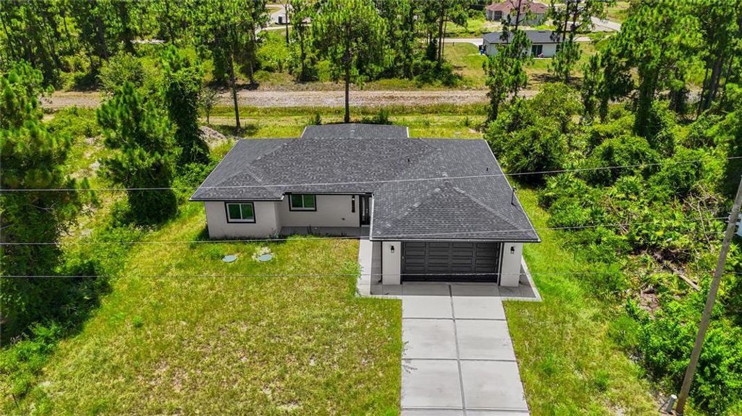 Front exterior of a new home in , Lehigh Acres, FL, highlighting curb appeal (Image 21). Front exterior of a new home in , Lehigh Acres, FL, highlighting curb appeal (Image 21).