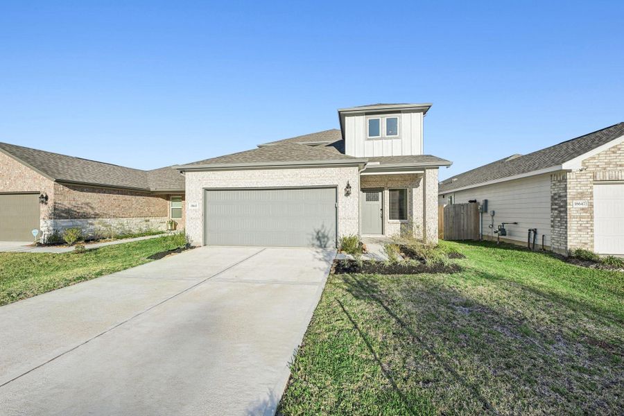 Front exterior of a new home in Landing Meadows - Traditional Series, New Caney, TX, highlighting curb appeal (Image 1). Front exterior of a new home in Landing Meadows - Traditional Series, New Caney, TX, highlighting curb appeal (Image 1).