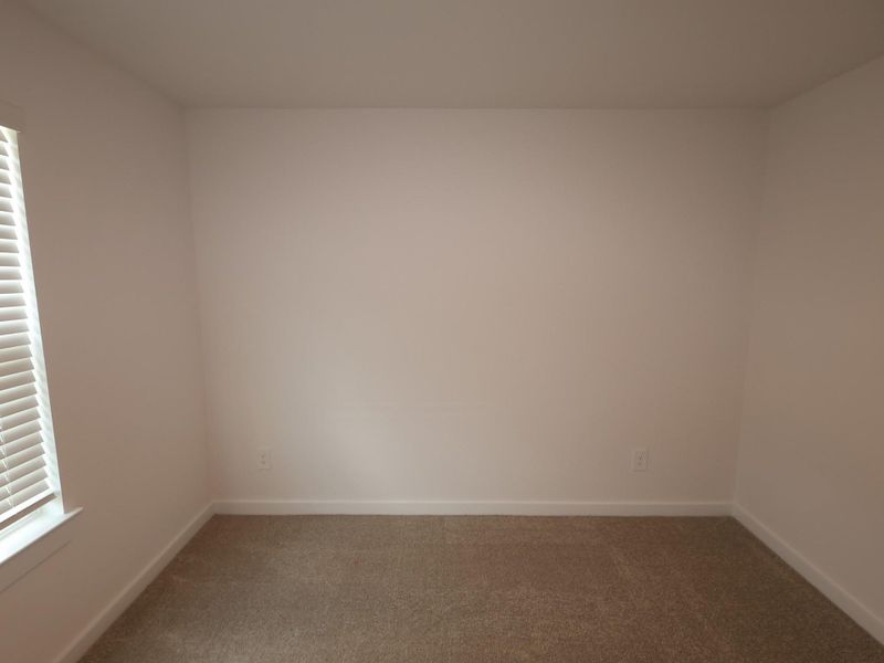 Spacious, unfurnished interior of a new home in Pinewood at Grand Texas, New Caney (Image 8).