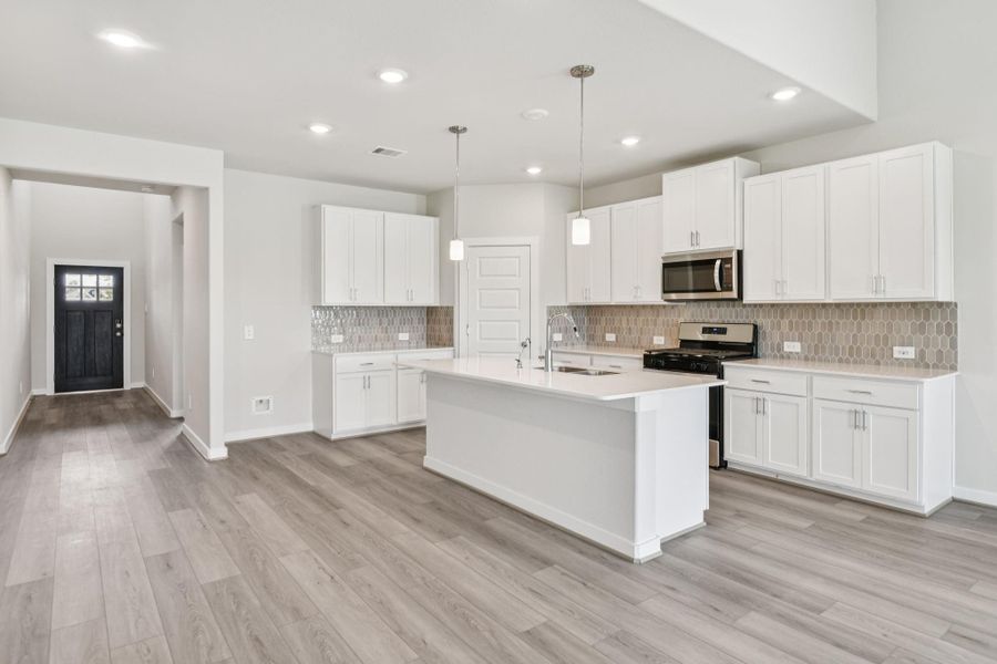 Furnished interior view inside a new home in Pine Lake Cove - Classic Series, Montgomery (Image 4).