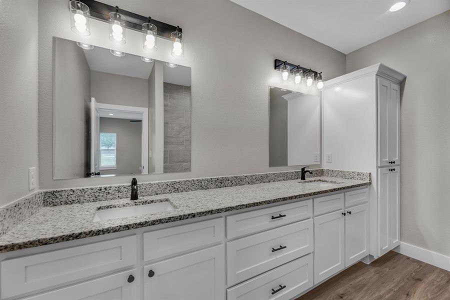 Bathroom with vanity and hardwood / wood-style flooring