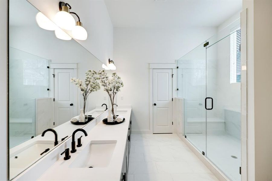 Luxurious Ensuite Bath with Dual Vanities and Glass-Enclosed Shower