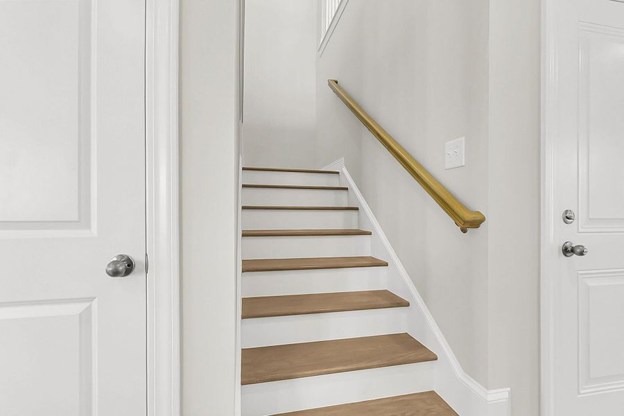 Spacious, unfurnished interior of a new home in Tidewater at Lakes of Cane Bay, Summerville (Image 39).
