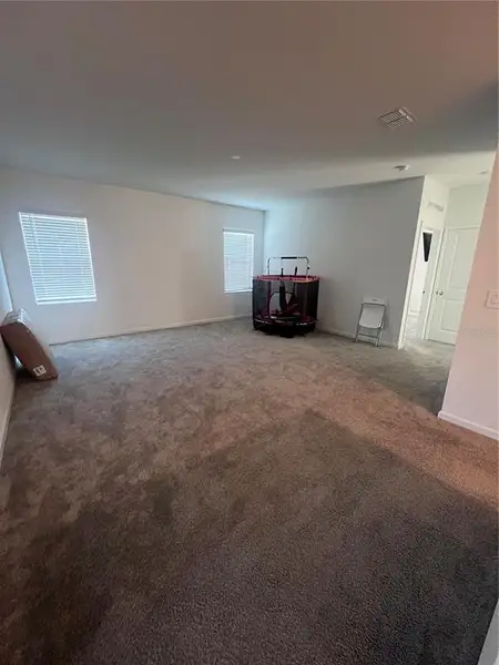 Spacious, unfurnished interior of a new home in Wellness Ridge: Estates Collection, Clermont (Image 6).