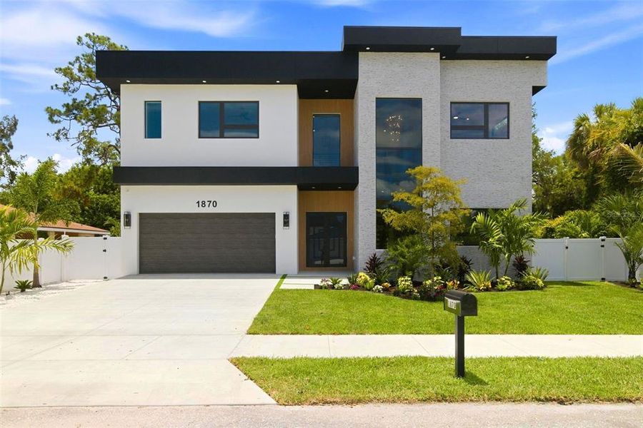Front exterior of a new home in , Sarasota, FL, highlighting curb appeal (Image 26).