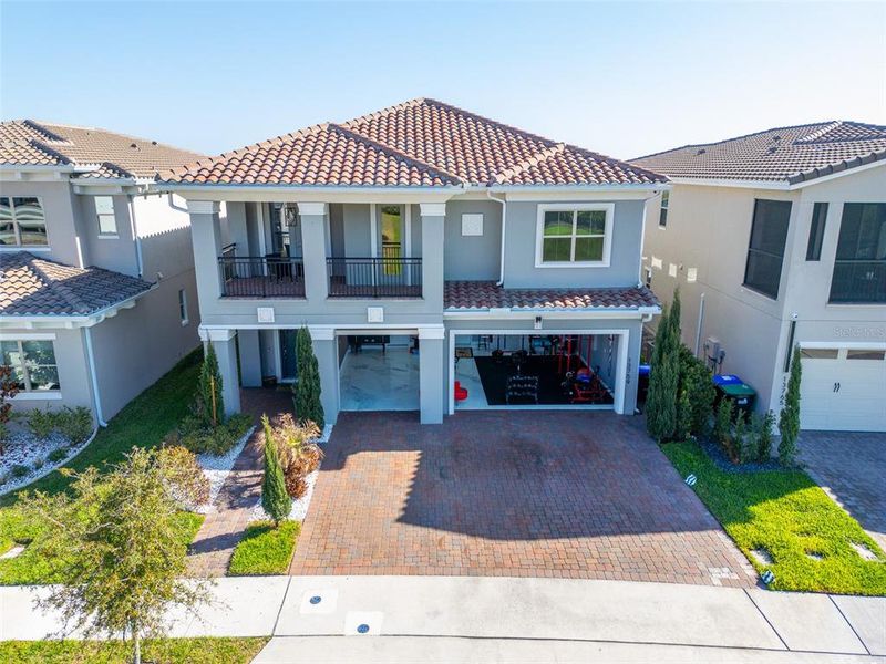 Front exterior of a new home in , Orlando, FL, highlighting curb appeal (Image 23).