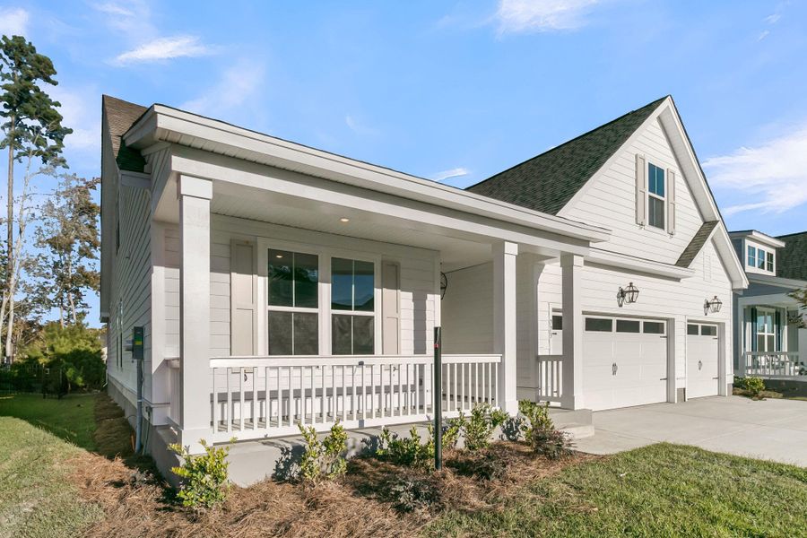 Exterior details and patio area of a home in Tidewater at Lakes of Cane Bay, Summerville (Image 27).