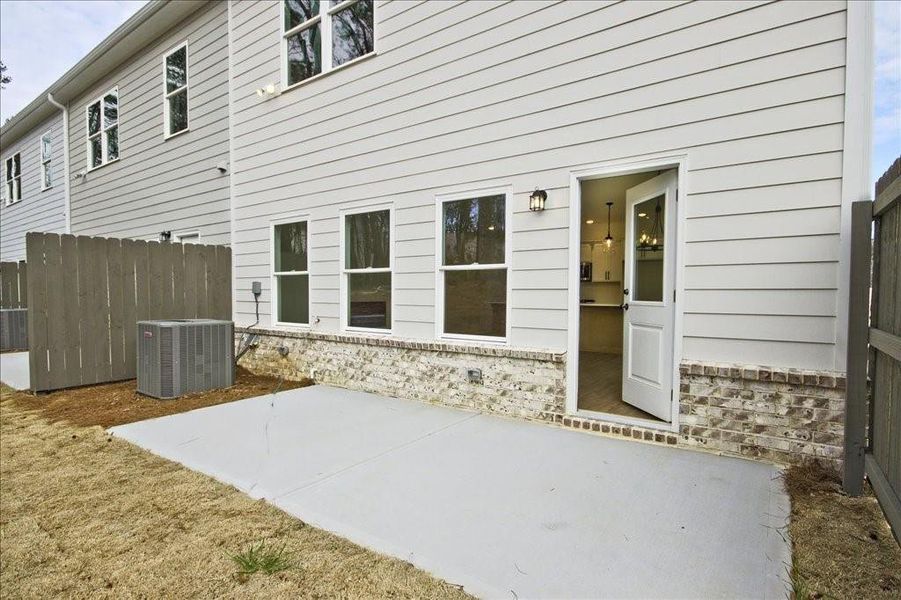 Front exterior of a new home in River Walk Place, Lawrenceville, GA, highlighting curb appeal (Image 18).