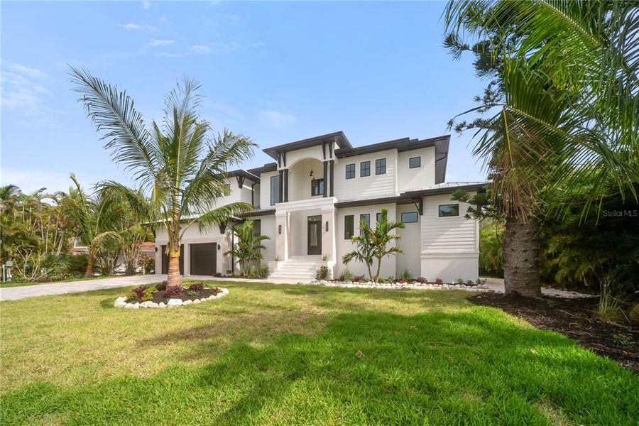 Front exterior of a new home in , Longboat Key, FL, highlighting curb appeal (Image 34). Front exterior of a new home in , Longboat Key, FL, highlighting curb appeal (Image 34).