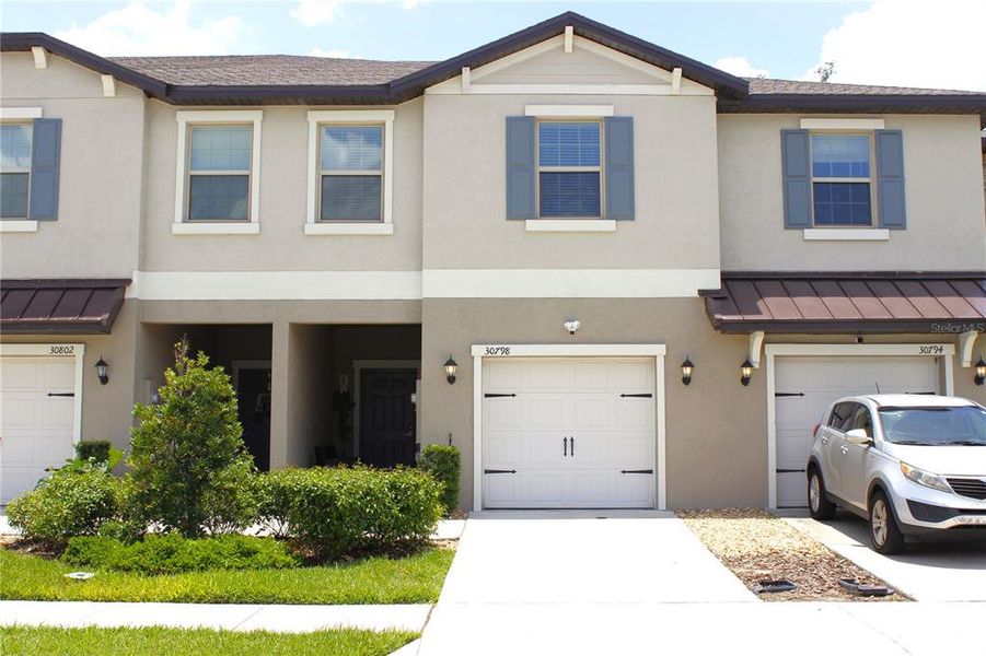 Front exterior of a new home in , Wesley Chapel, FL, highlighting curb appeal (Image 1). Front exterior of a new home in , Wesley Chapel, FL, highlighting curb appeal (Image 1).
