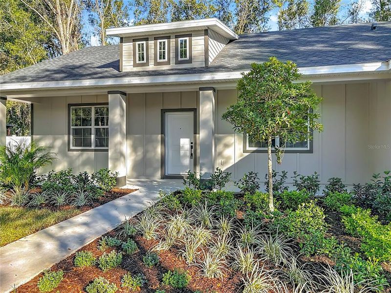 Front exterior of a new home in , Lake Helen, FL, highlighting curb appeal (Image 16). Front exterior of a new home in , Lake Helen, FL, highlighting curb appeal (Image 16).