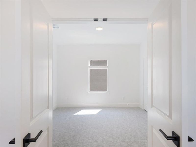 Spare room featuring light carpet and recessed lighting Spare room featuring light carpet and recessed lighting