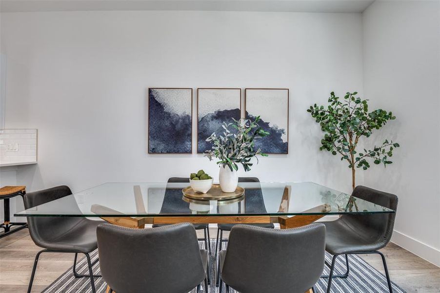 Dining space featuring wood finished floors