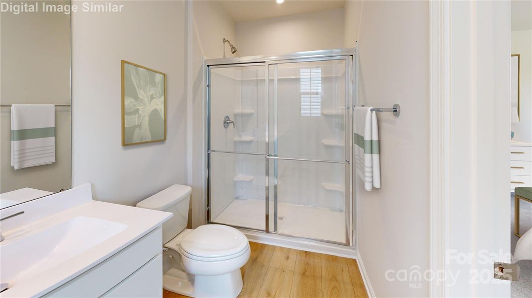This en-suite bath is a total showstopper! A sleek framed shower door, dual vanities with matching mirrors, and tons of cabinet space make mornings effortless and evenings relaxing. Stylish, spacious, and spa-inspired—it’s your daily dose of luxury! This en-suite bath is a total showstopper! A sleek framed shower door, dual vanities with matching mirrors, and tons of cabinet space make mornings effortless and evenings relaxing. Stylish, spacious, and spa-inspired—it’s your daily dose of luxury!