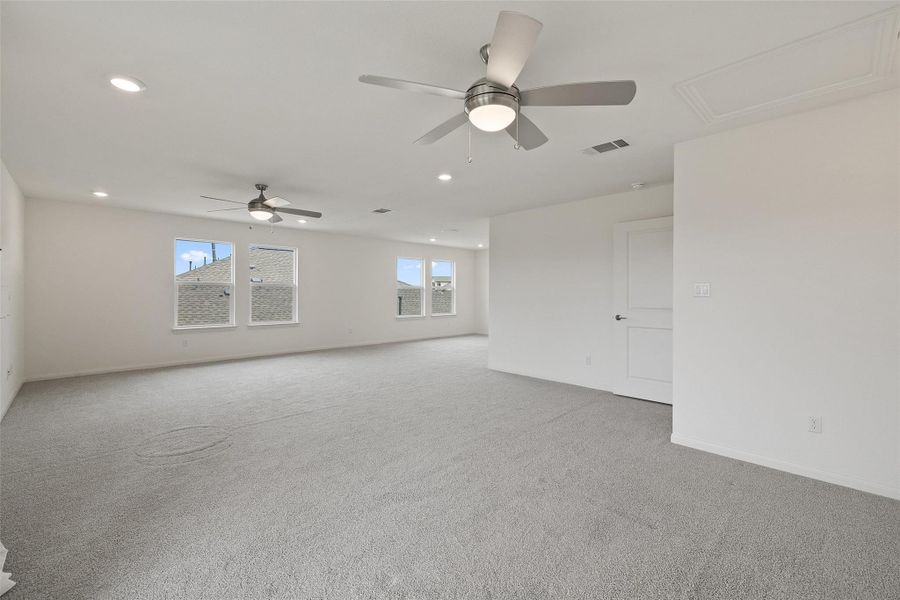 Unfurnished room with baseboards, light colored carpet, visible vents, ceiling fan, and recessed lighting