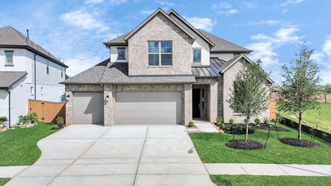 Front exterior of a new home in Marvida, Cypress, TX, highlighting curb appeal (Image 23).