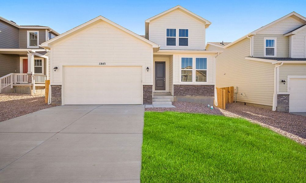 Exterior details and patio area of a home in Ridge at Lorson Ranch, Colorado Springs (Image 3).