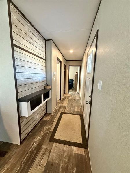 Hallway with dark wood-style floors