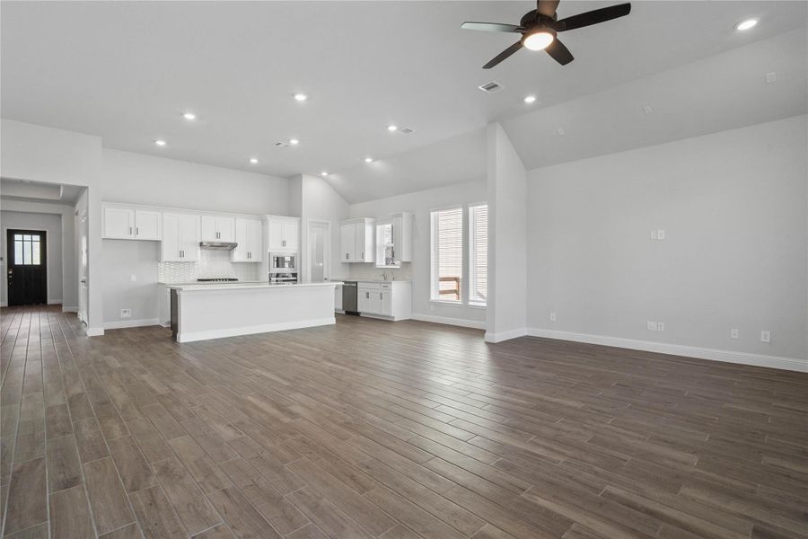 Stunning open-concept design seamlessly connecting the living, dining, and kitchen areas—perfect for both everyday living and entertaining! Stunning open-concept design seamlessly connecting the living, dining, and kitchen areas—perfect for both everyday living and entertaining!