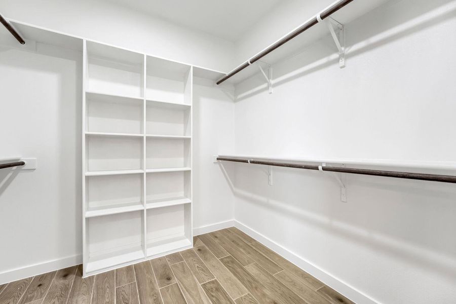 Ample shelving and hanging space offer a meticulously organized wardrobe solution.