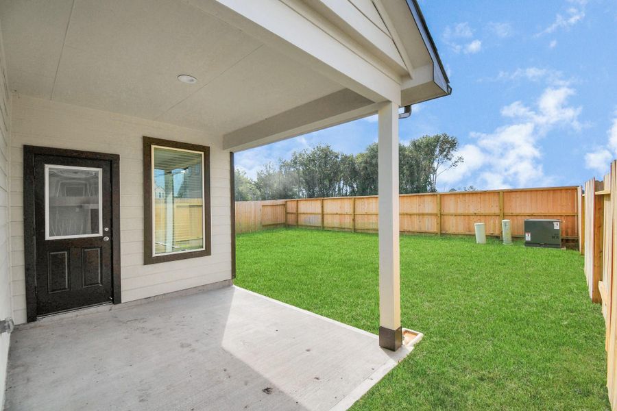 Experience outdoor living at its finest on this expansive covered patio, thoughtfully designed for BBQs and delightful outdoor dining