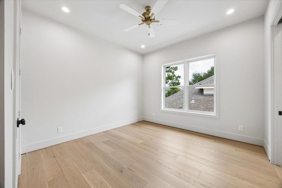 Guest bedroom 1 is located just off the game room and features hardwood floors, creating a comfortable and flexible upstairs retreat. Guest bedroom 1 is located just off the game room and features hardwood floors, creating a comfortable and flexible upstairs retreat.