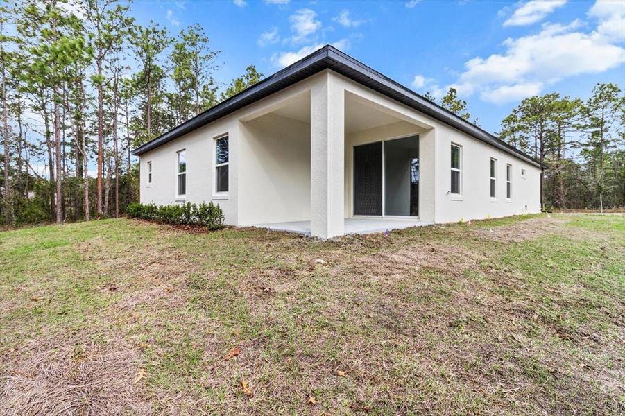 Front exterior of a new home in , Homosassa, FL, highlighting curb appeal (Image 1).