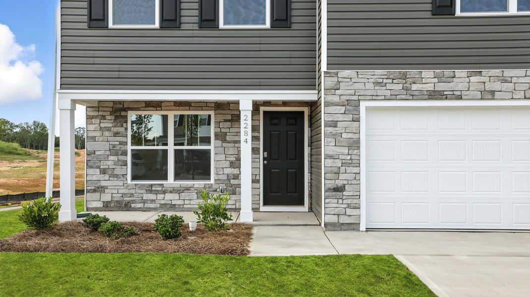 Exterior details and patio area of a home in Ravencrest, Roebuck (Image 2). Exterior details and patio area of a home in Ravencrest, Roebuck (Image 2).