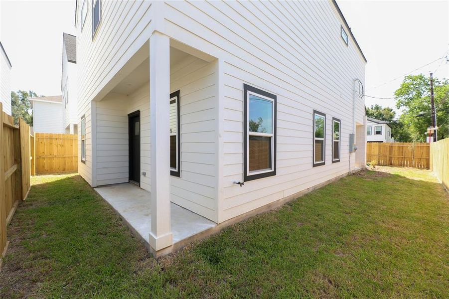 Corner view of back yard and patio.