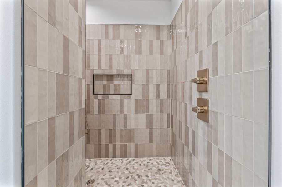 Full bath with a tile shower