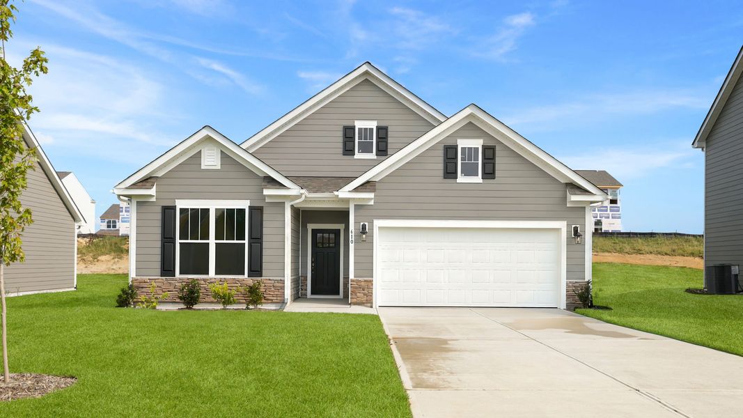 Front exterior of a new home in Reserve at Tap Root Farms, Fletcher, NC, highlighting curb appeal (Image 1). Front exterior of a new home in Reserve at Tap Root Farms, Fletcher, NC, highlighting curb appeal (Image 1).