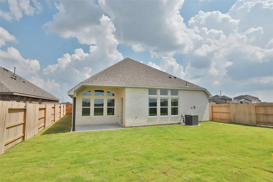 Exterior details and patio area of a home in Creekhaven, Iowa Colony (Image 3). Exterior details and patio area of a home in Creekhaven, Iowa Colony (Image 3).