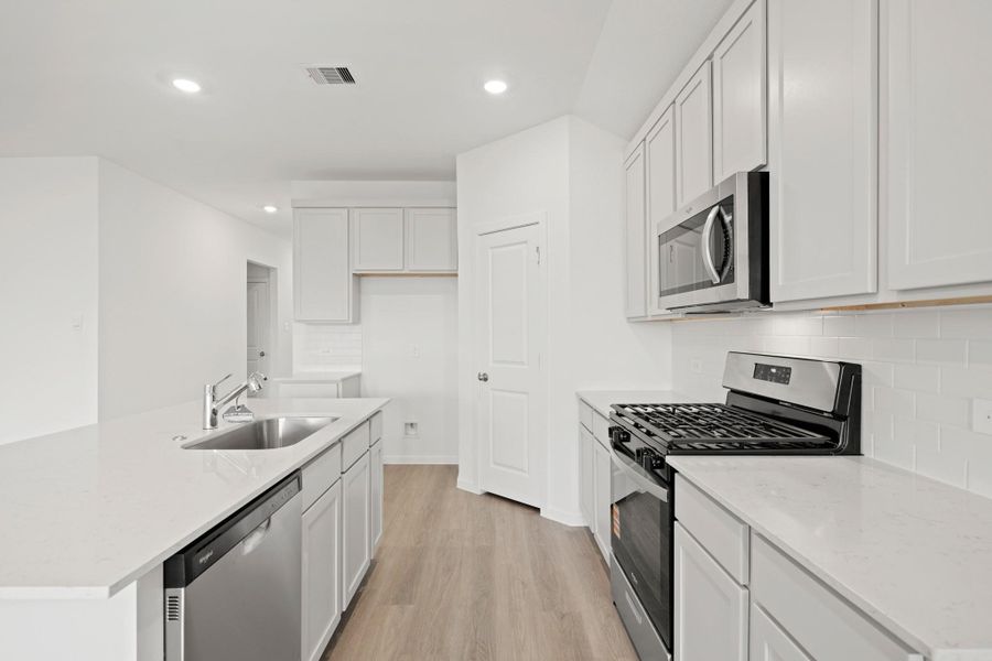 Furnished interior view inside a new home in Sunterra Lakes, Brookshire (Image 9).