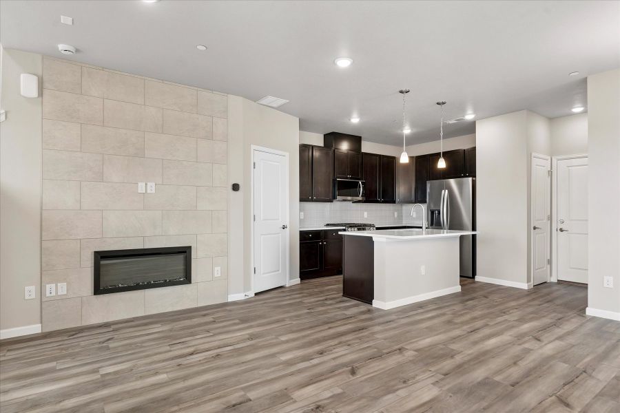 A kitchen with wooden floors.
