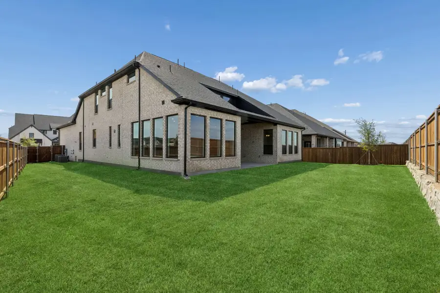 Exterior details and patio area of a home in The Grove Frisco, Frisco (Image 3).