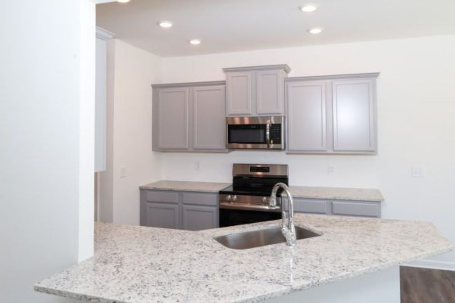 Representative furnished interior of a home built from the Emory Townhome by Piedmont Residential in The Retreat at Browns Ridge, Newnan (Image 11).